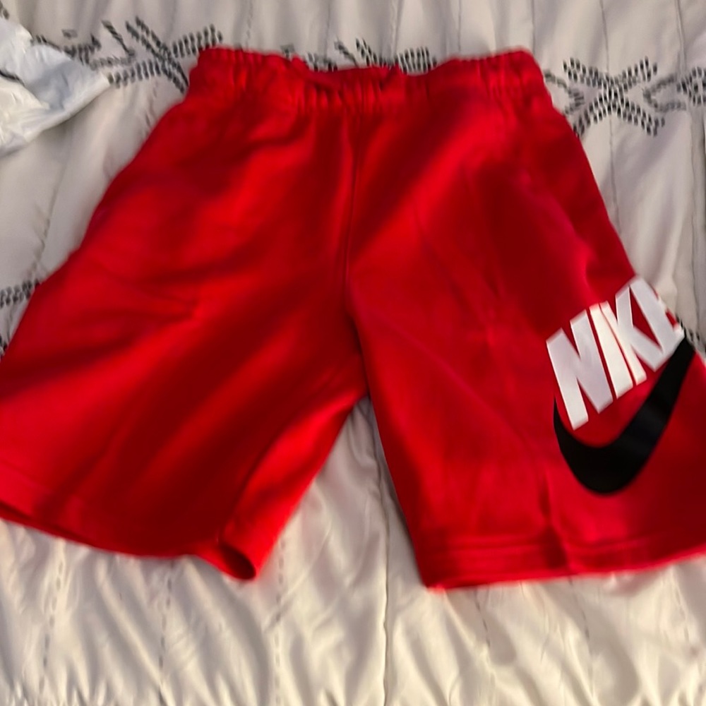 Nike red boys shorts.